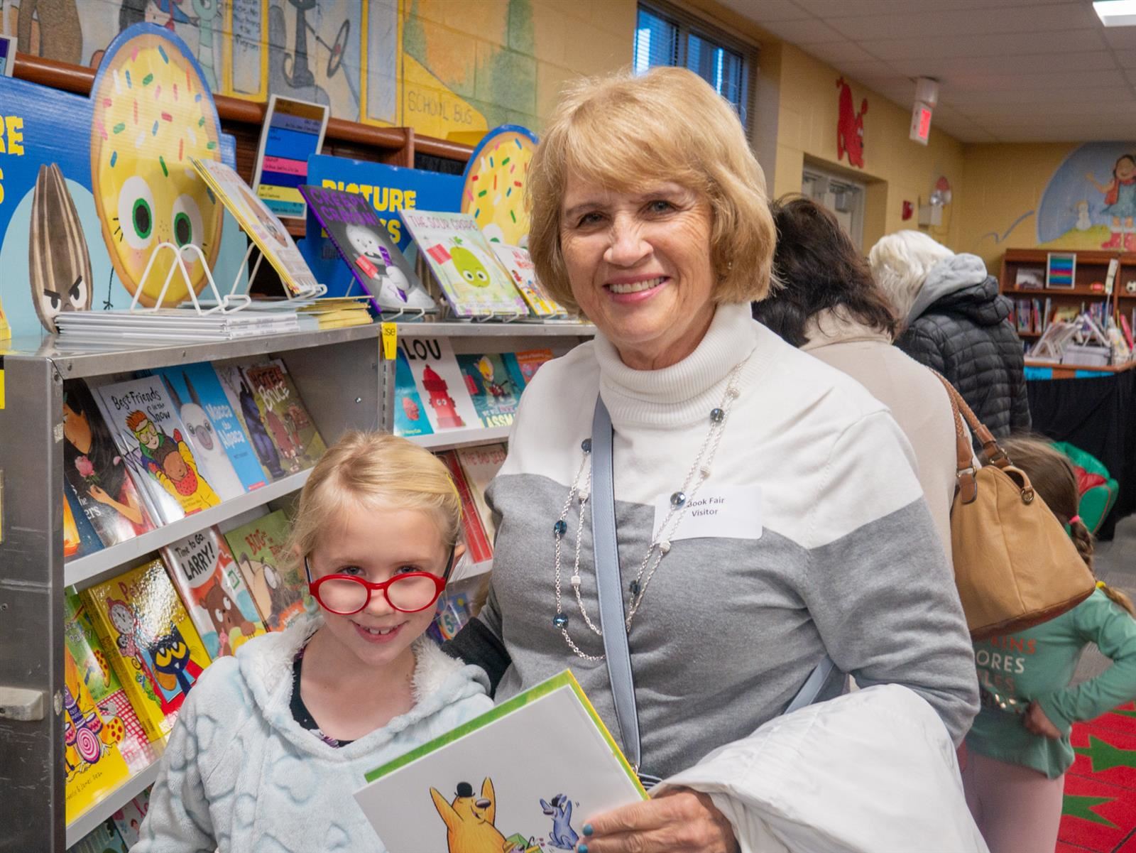 grandma and girl at the book fair